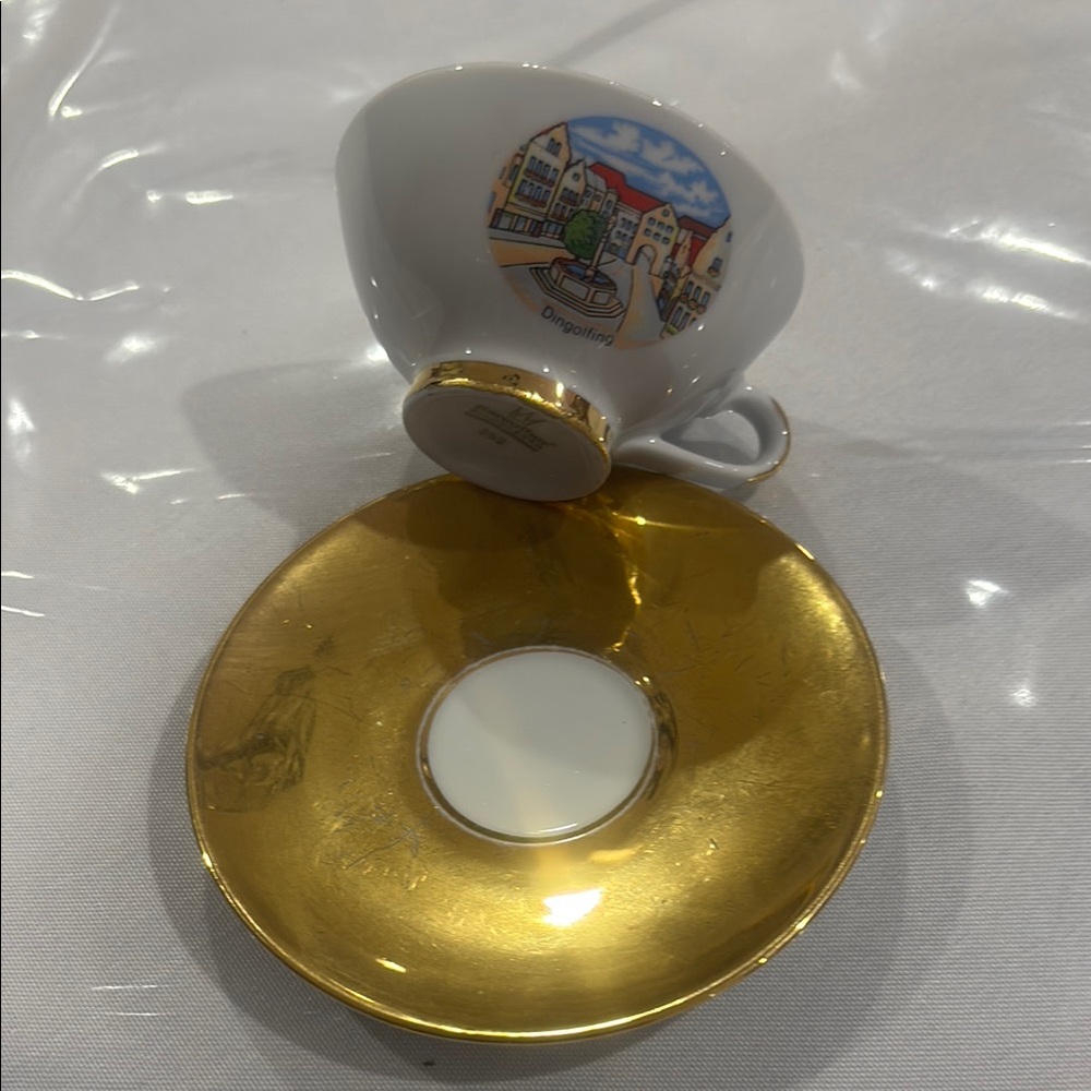Gold and White Teacup with Saucer